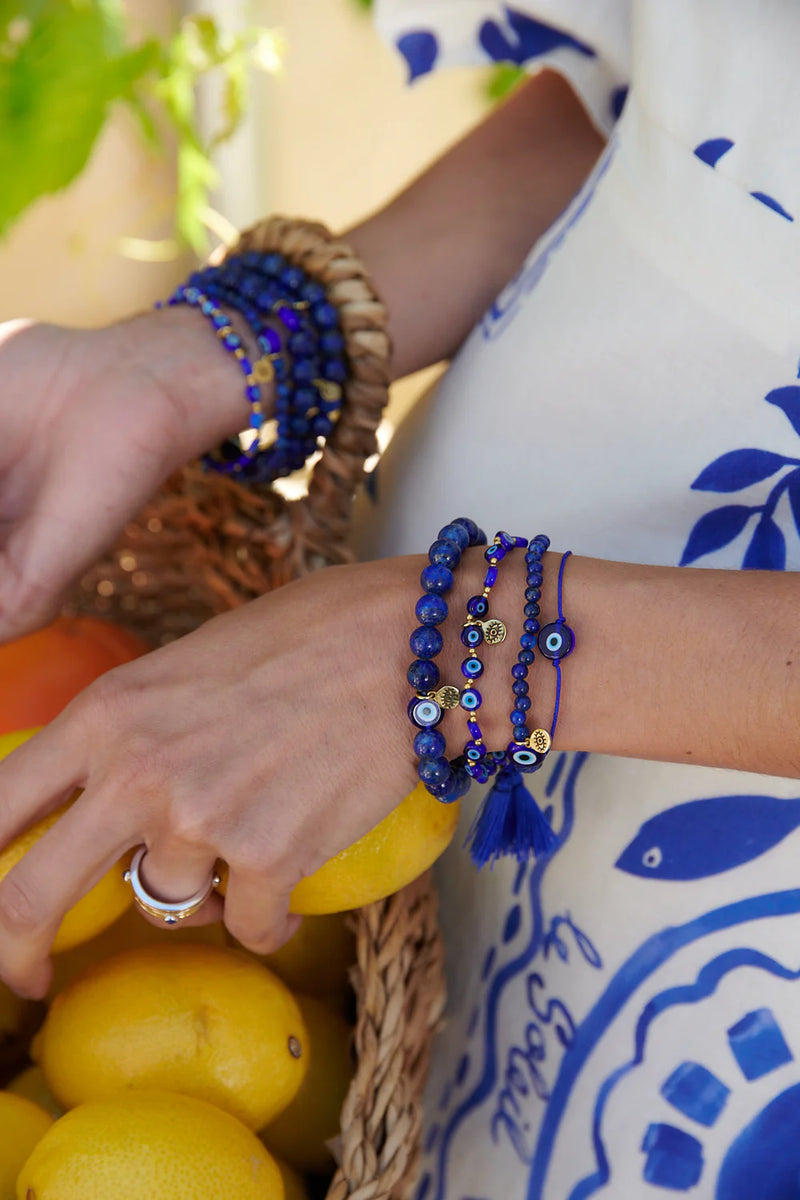 Mati evil eye glass and brass bead bracelet